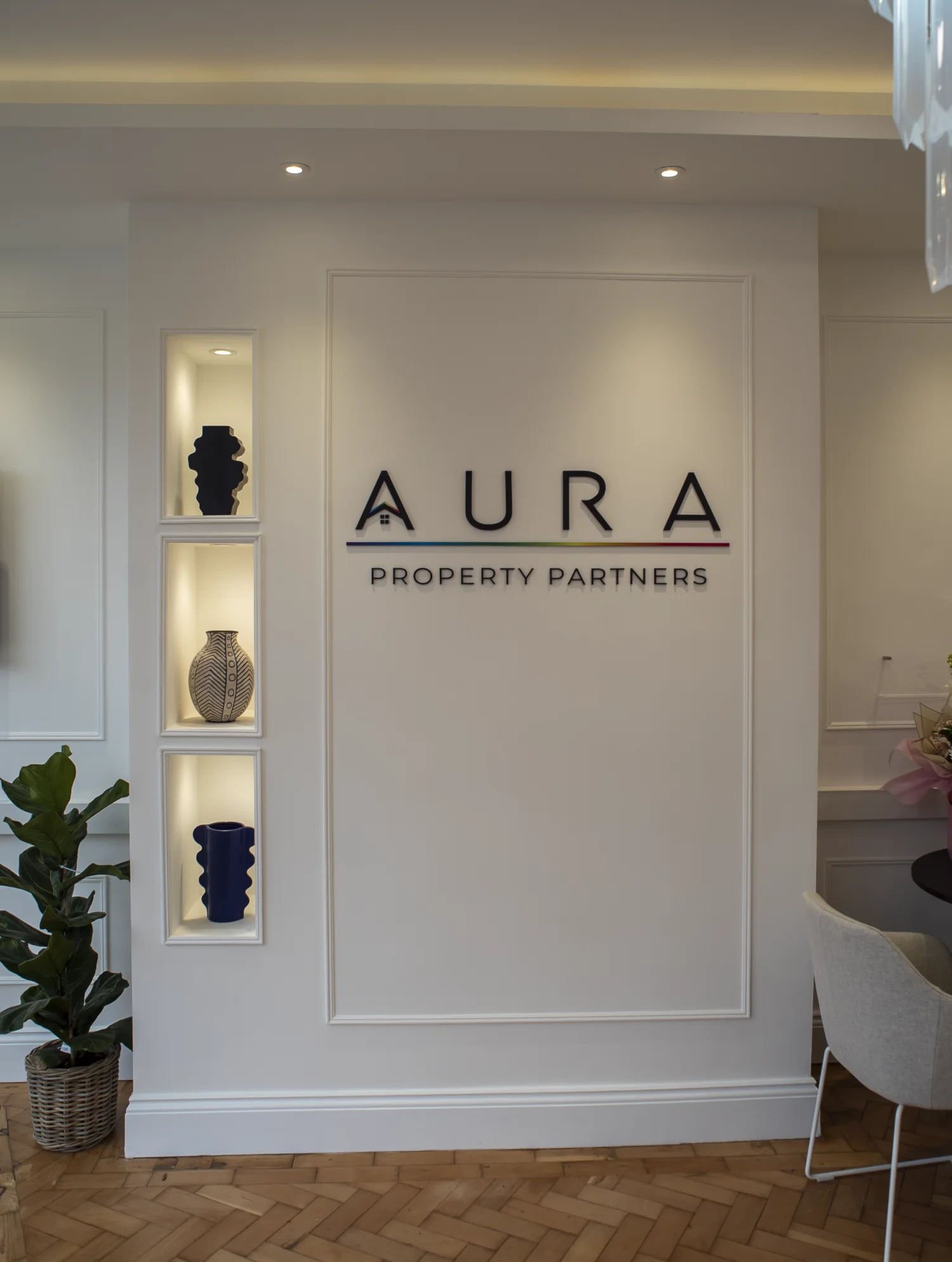 Aura Property Partners reception area and office signage